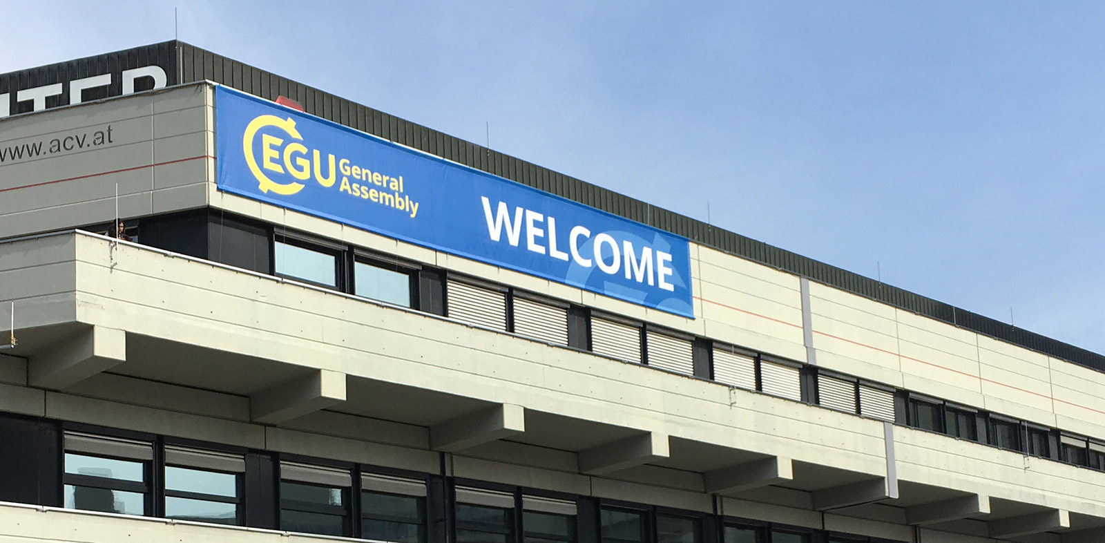 EGU welcome banner on building