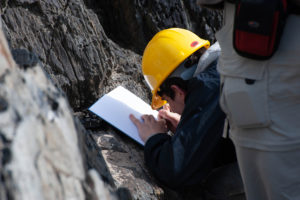 Student with notebook and hard hat