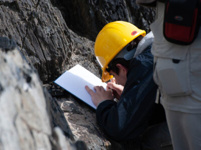 Student with notebook and hard hat