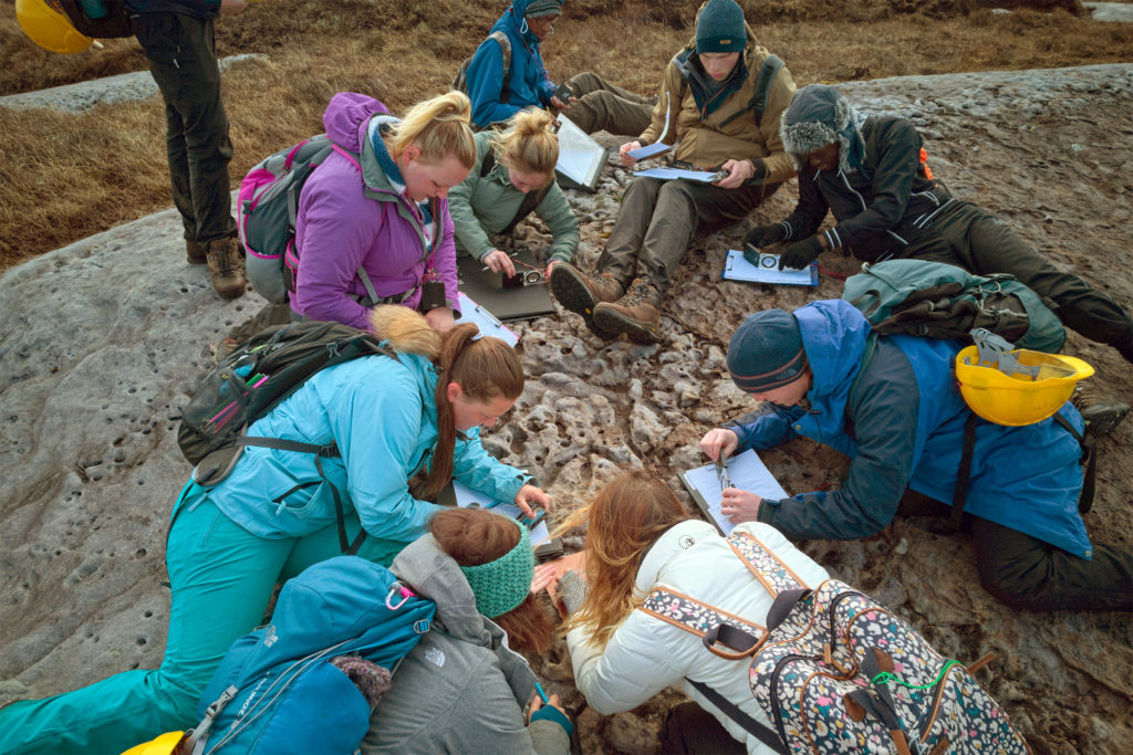 Looking at rocks on a field trip